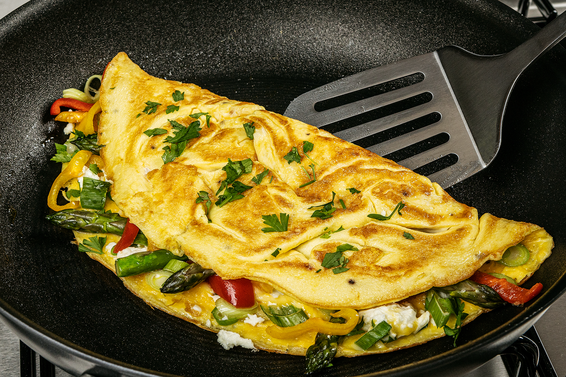 Food photography of an omelette being cooked in a Circulon pan